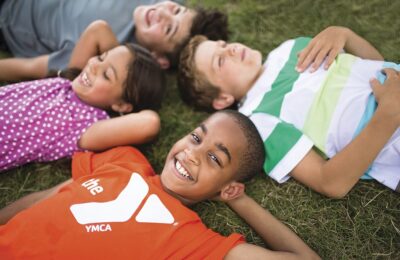 Kids laying on the grass