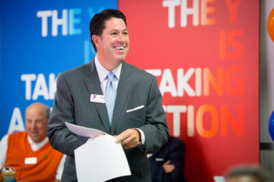 Mike Manuel sitting on a chair at Y Event