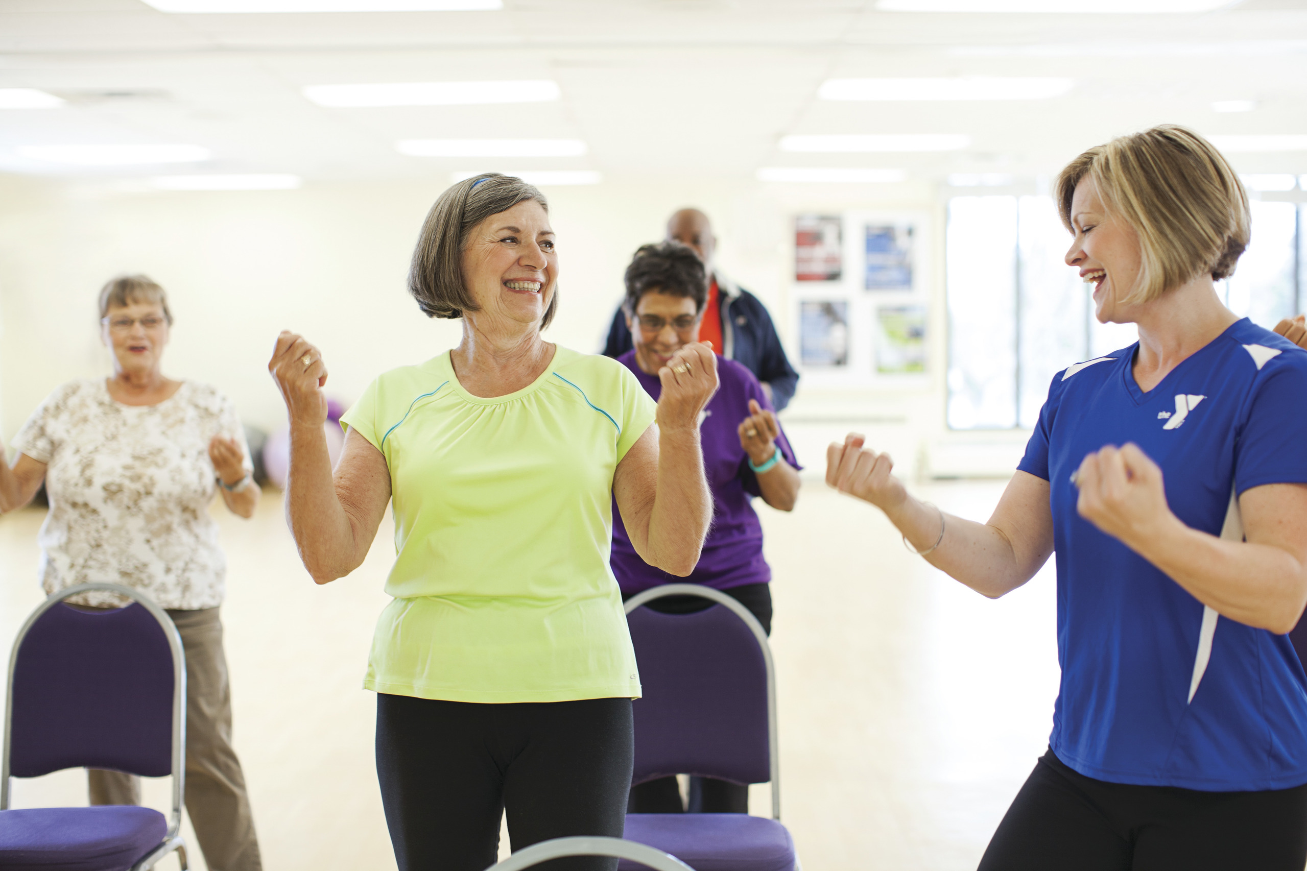Group of senior women together in a cardio dance class
