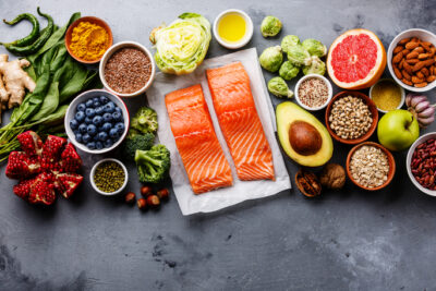 Fruits, vegetables, and salmon on a table