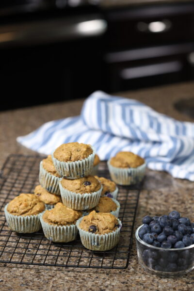 Blueberry Muffins on Cooling Rack with Blueberries