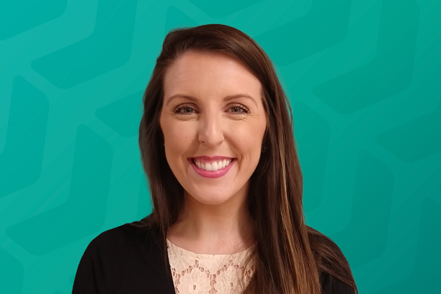 Headshot of Chrissy Hoffman in front of green chevron background