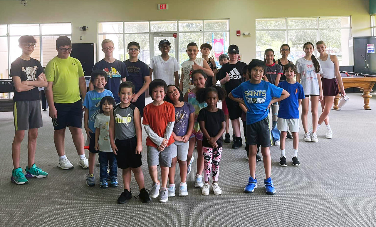 A group of kids during the weekly Homeschool P.E. class at the YMCA
