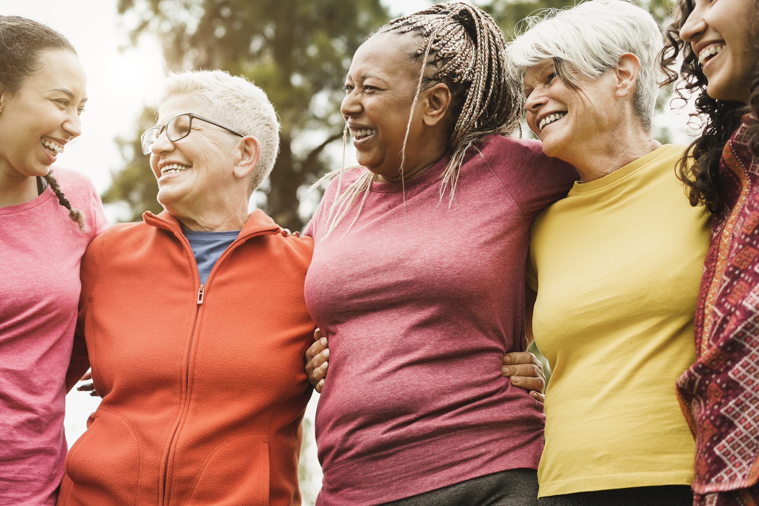 Happy multi generational women having fun together after sport workout outdoor - Focus on center woman face