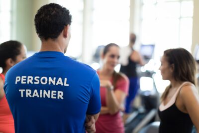 Personal Trainer with a t-shirt on it that says Personal Trainer