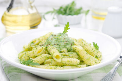 Penne Pasta with Pesto Sauce on White Plate
