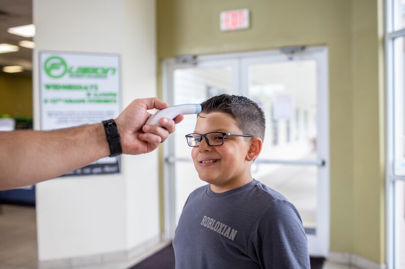Child Undergoing Temperature Check
