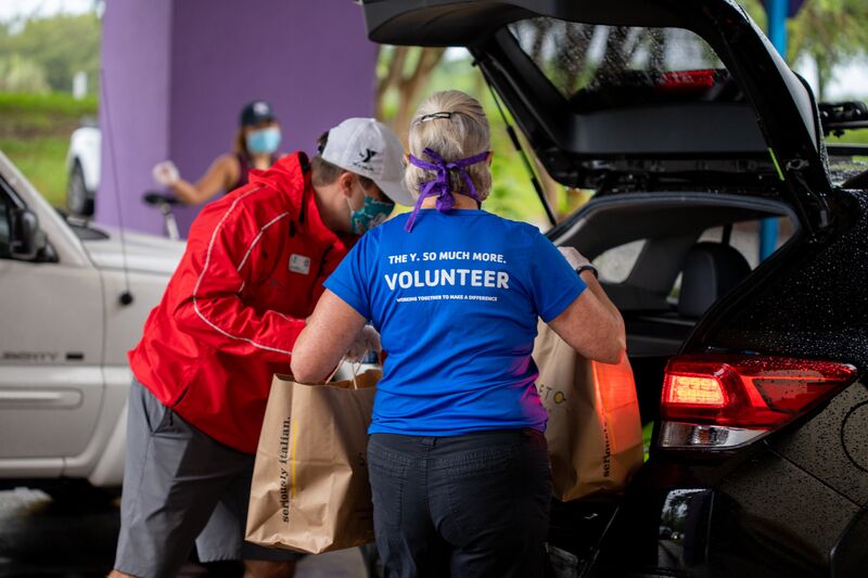 Volunteers Packing Cars with Supplies at Oviedo