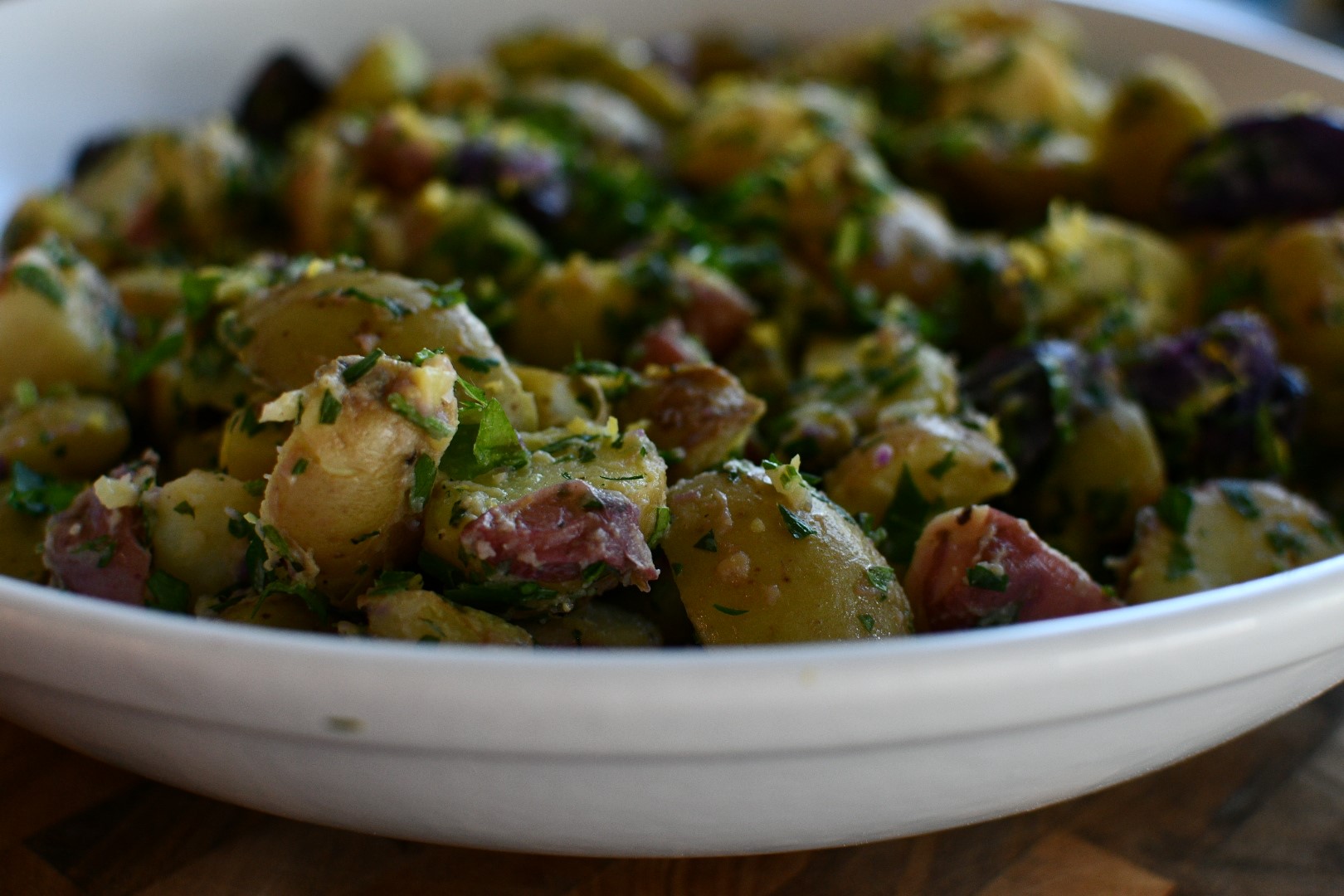 Potato Salad with Roasted Tomatoes in a white plate