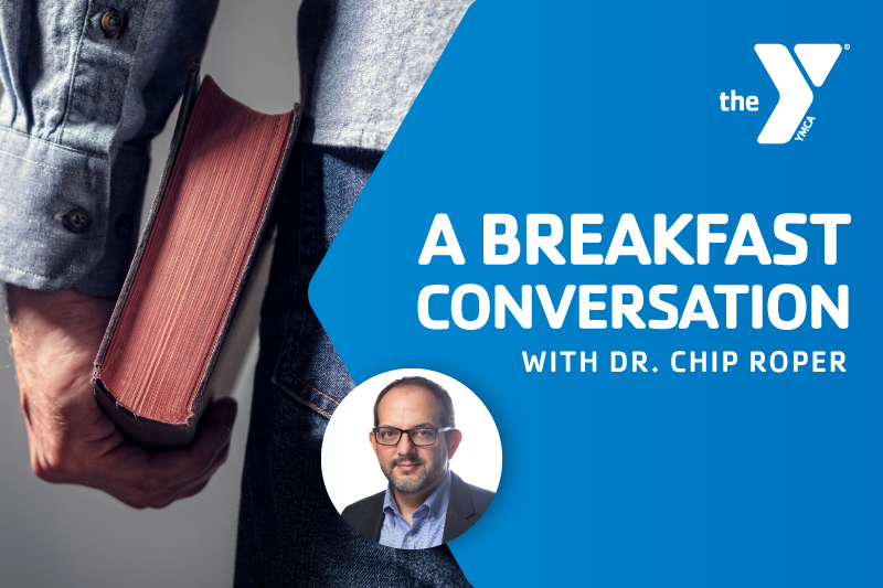 Image with the words A Breakfast Conversation with Dr. Chip Roper in blue with a man holding a bible and the YMCA logo