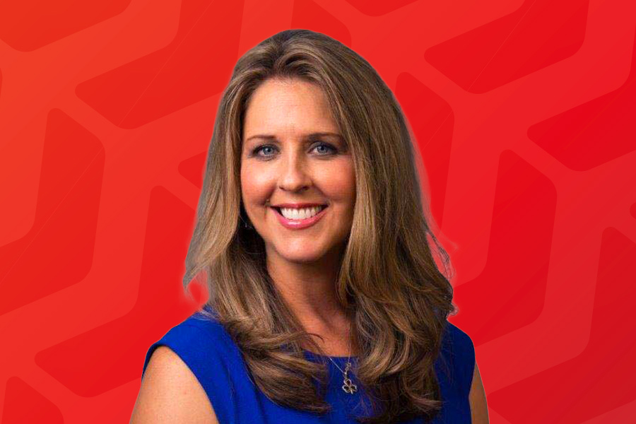 Headshot of Colleen Manahan in front of red chevron background