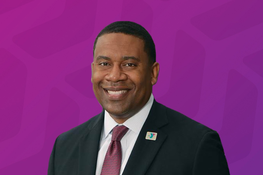 Headshot of Kevin Bolding in front of purple chevron background