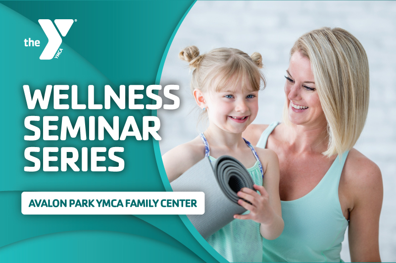 Image of a woman smiling at her daughter who is holding a yoga mat with the words Wellness Seminar