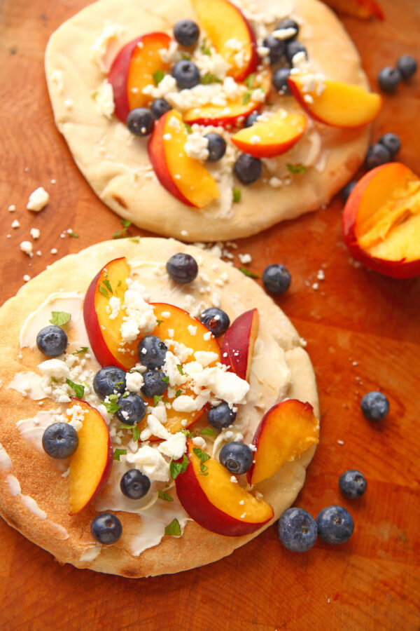 Flatbreads made with mascarpone, fresh peaches, blueberries and feta cheese