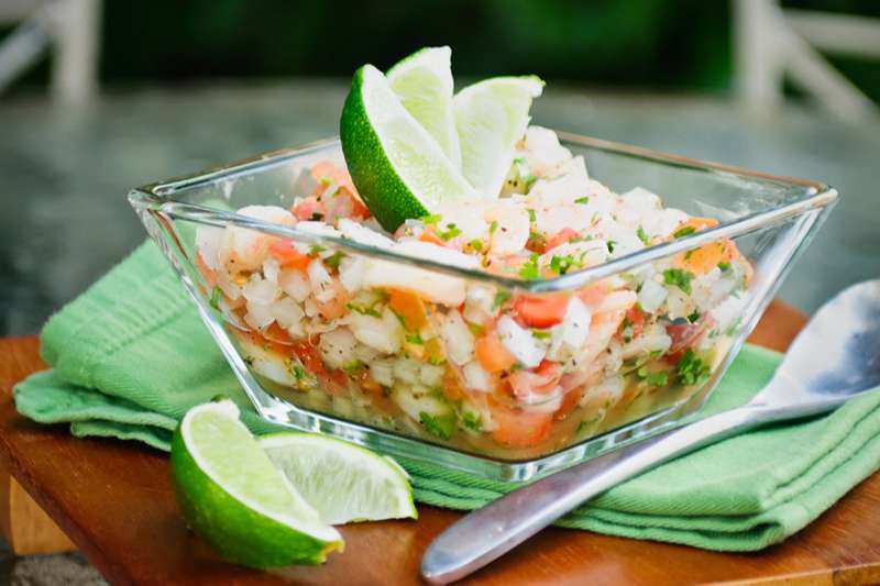 Shrimp ceviche in glass bowl with lime