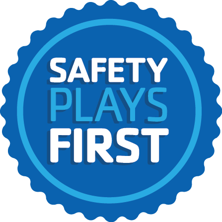 A blue safety badge that says Safety Plays Here in white and light blue