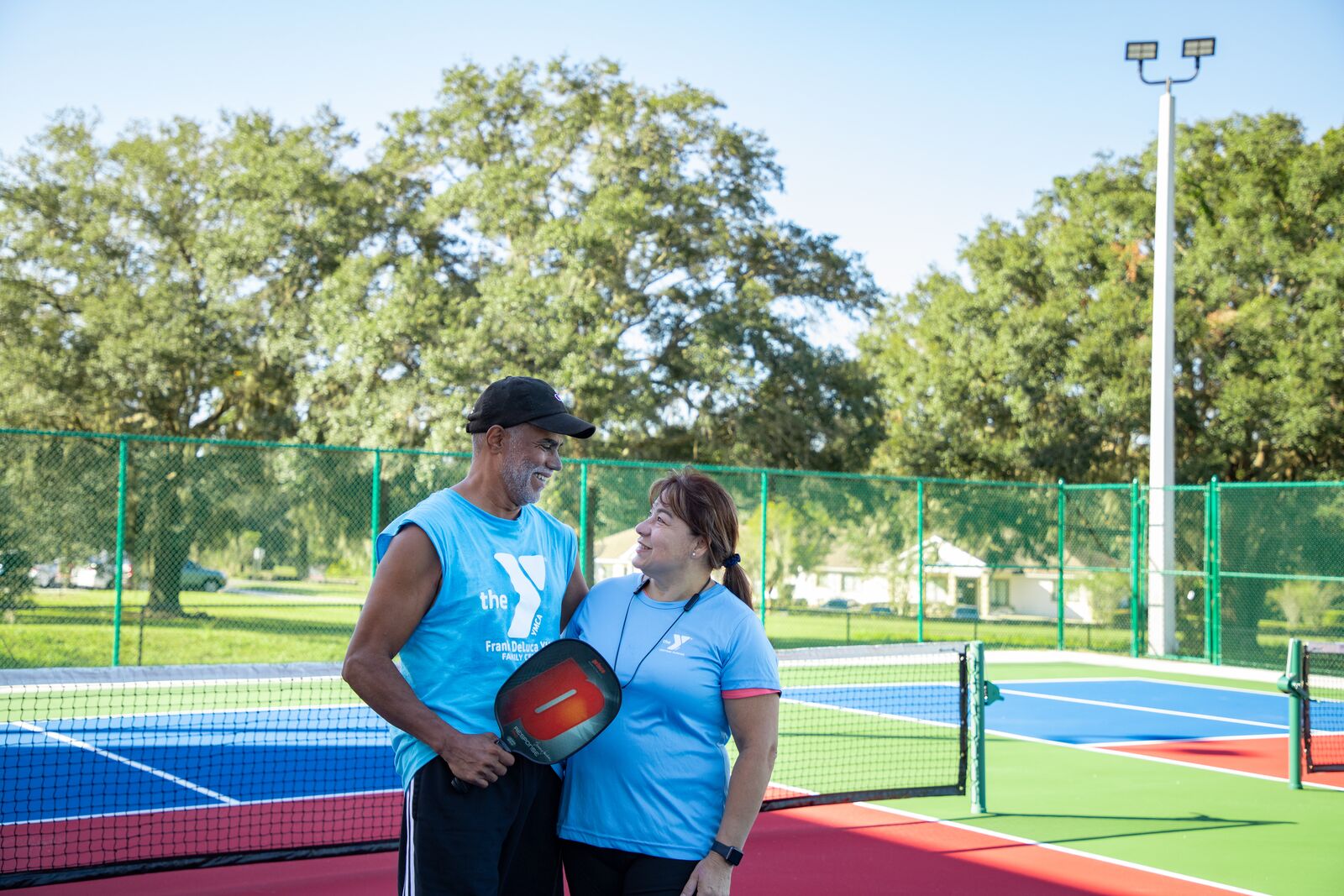 Couple on the pickleball court at Frank DeLuca YMCA in Ocala