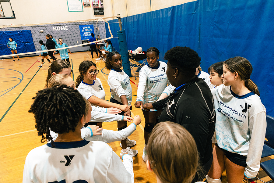 YMCA Jr. Valkyries Volleyball League team huddle