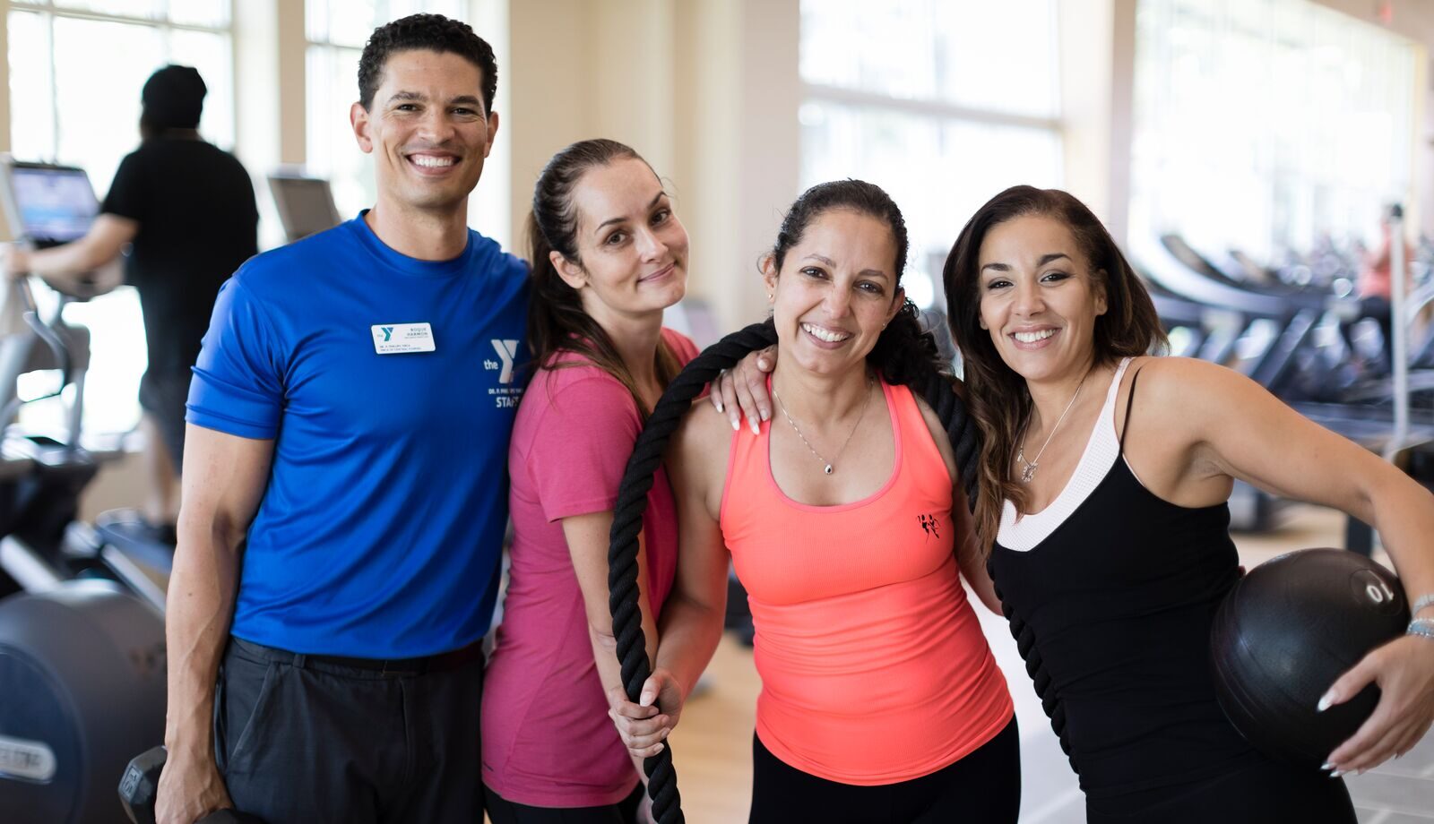 A group of people posing on the wellness floor
