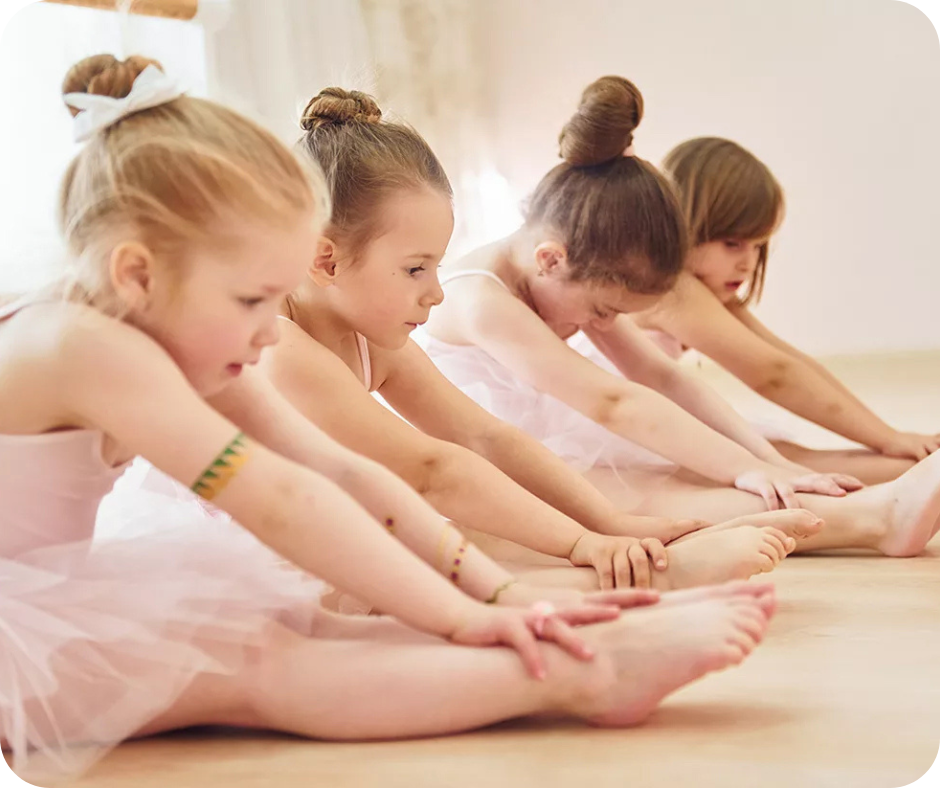 little ballerinas stretching with pink tutus