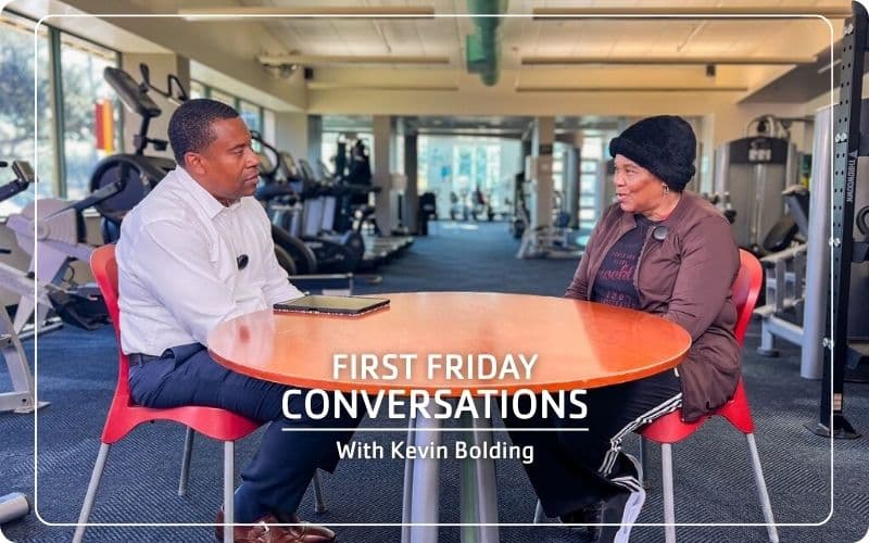 Kevin Bolding talking with Wayne Densch YMCA member inside the Y