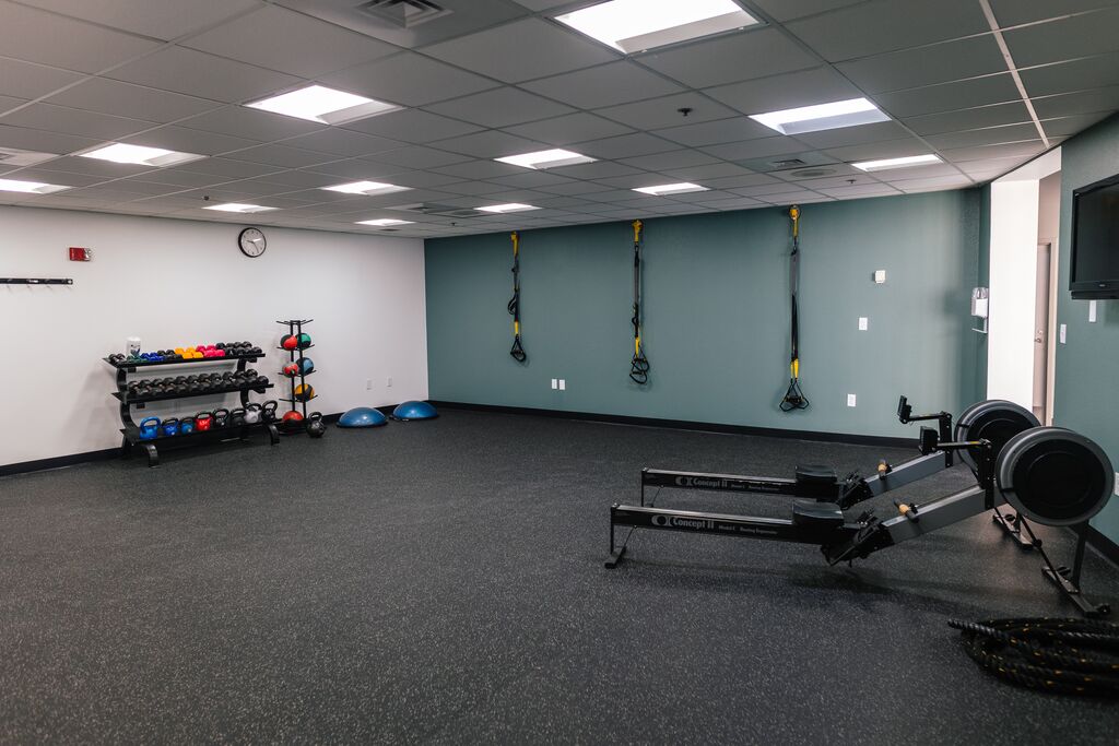 Open workout area at Parrish Health & Fitness Center, operated by the YMCA of Central Florida, with space for functional exercises and group workouts.