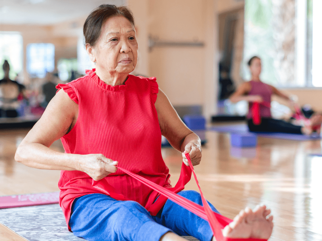 Woman stretching at the YMCA in a fitness space, preparing for a workout in a welcoming environment