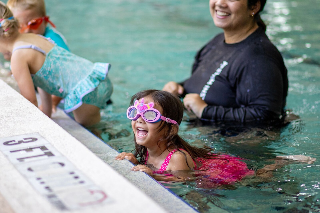 Kids learning about water safety during a swim lesson at the YMCA