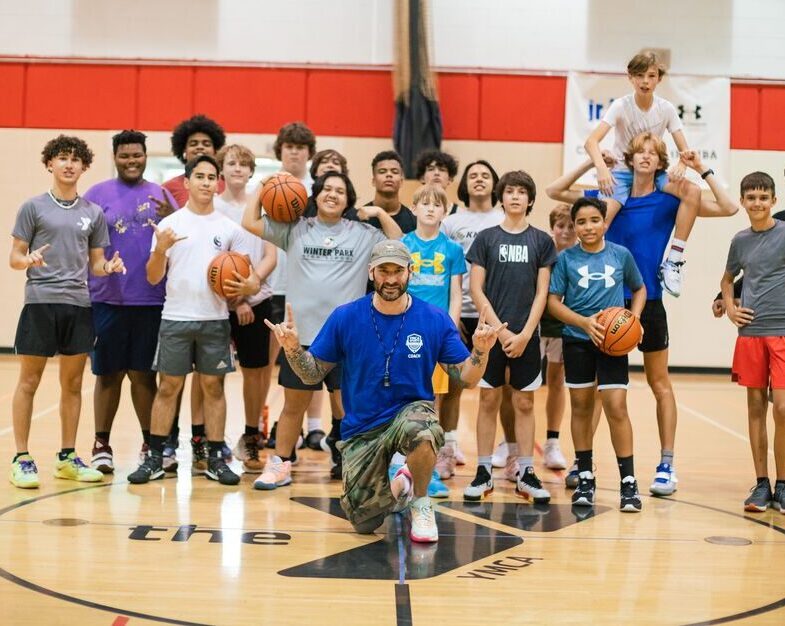 Coach Seth and a group of kids at a YMCA Youth Basketball Clinic in Orlando
