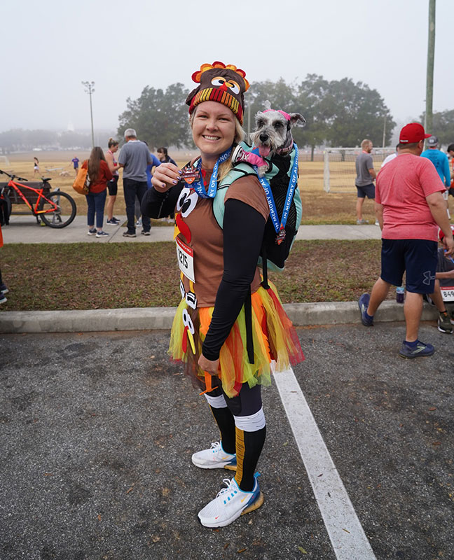 Frank DeLuca YMCA Turkey Trot participant with her dog