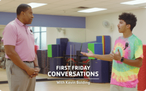 Kevin Bolding, CEO of YMCA of Central Florida, speaking with a camp counselor from the Lake Nona YMCA