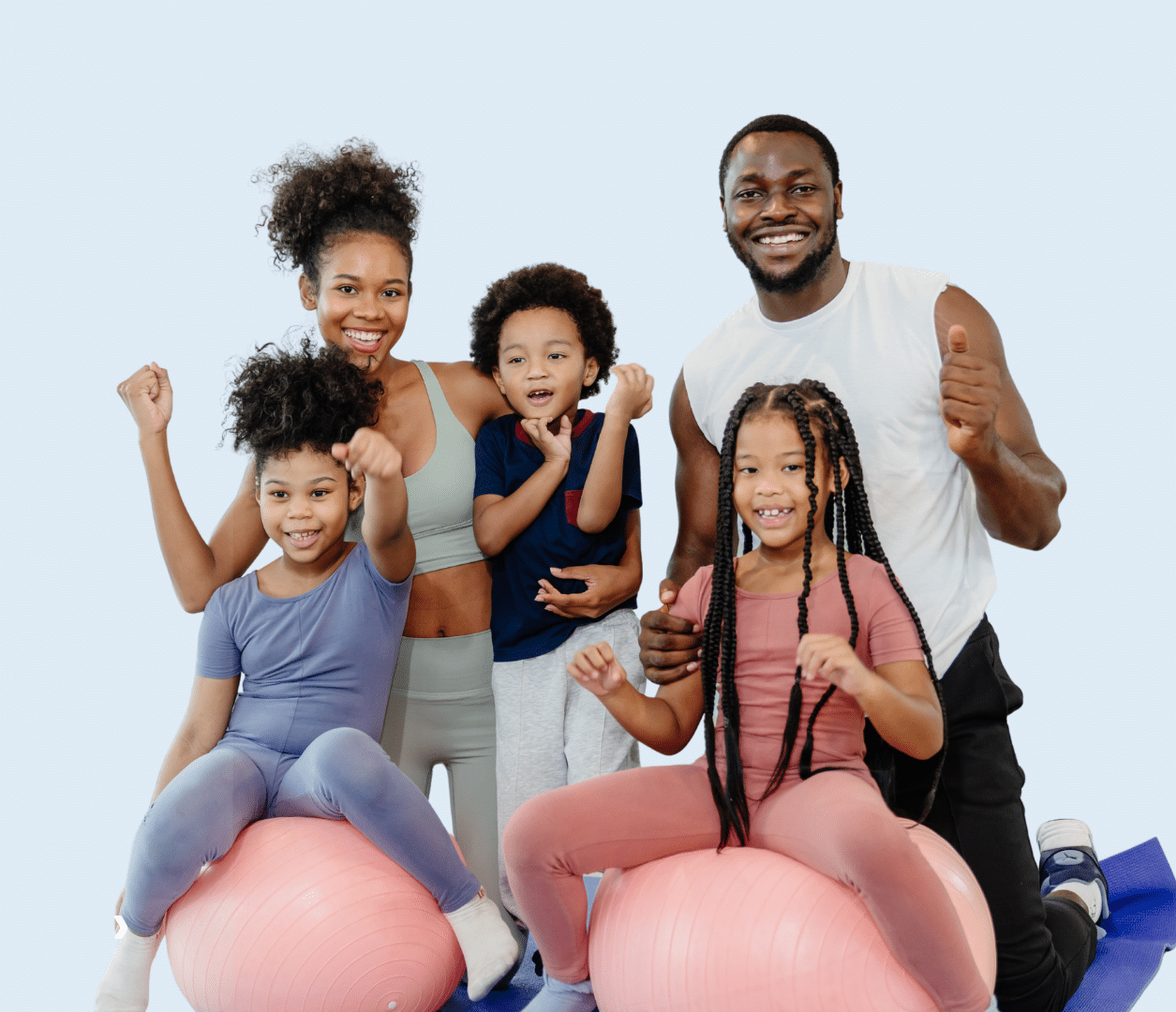 A family with parents and kids exercising at the YMCA